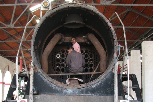 Rewari Steam Loco Shed: Workmen repairing the boiler